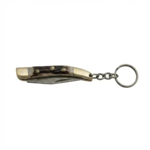 Closed stag handle toothpick knife showing brass bolsters and keychain attachment.