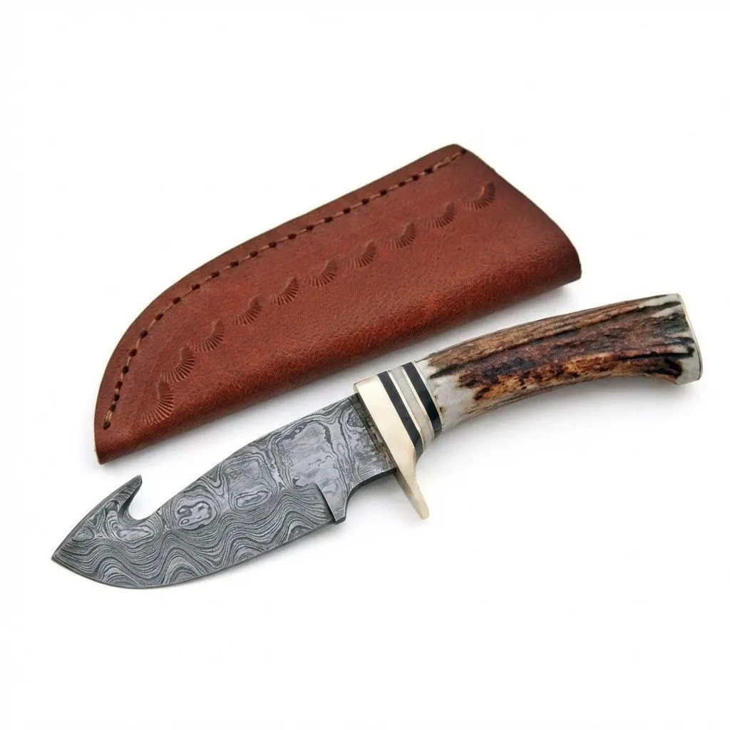 stag-handle-guthook-skinner-damascus-blade. Damascus Steel Gut Hook Skinner knife with gut hook and stag antler handle.