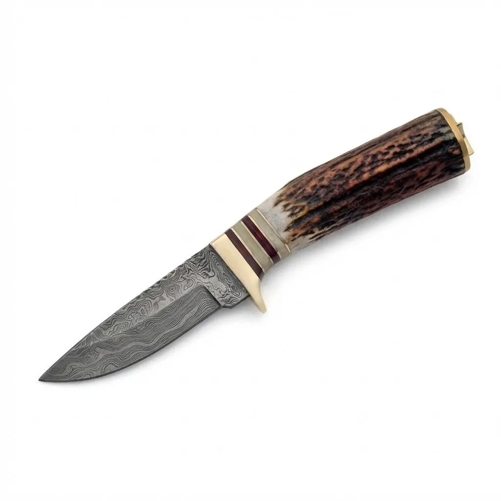 white-tail-stag-damascus-skinner-full-view. Full view of Damascus steel skinner with genuine stag antler handle and brass guard.