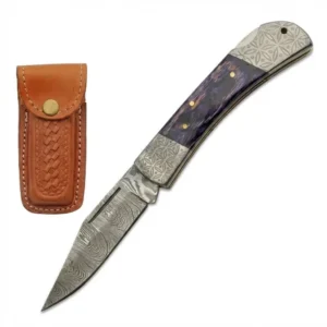 Damascus steel folding knife with a purple handle displayed alongside its brown leather belt sheath.