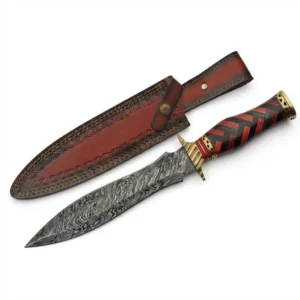 Handmade Damascus Collector Dagger displayed next to leather sheath