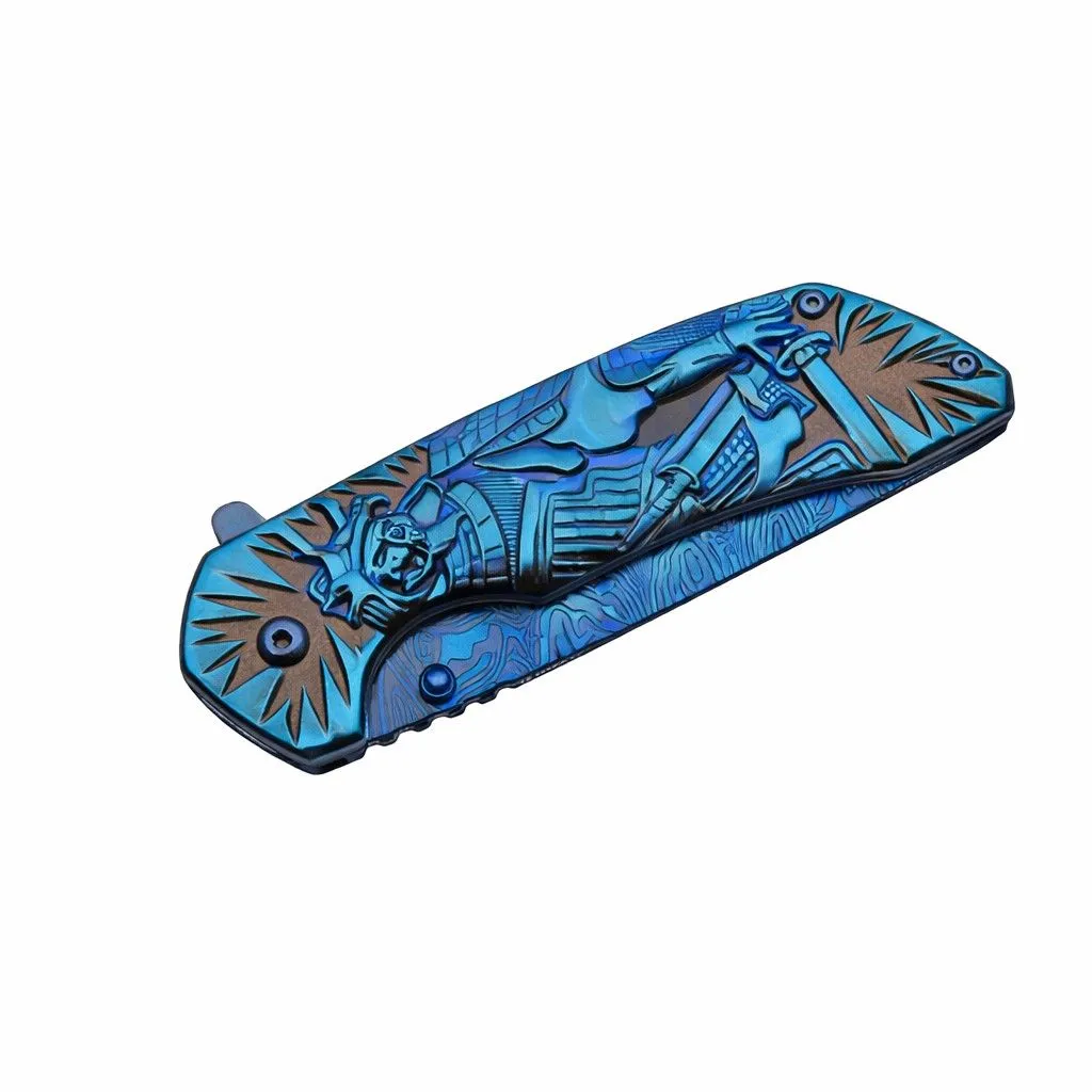 blue-samurai-folding-knife-closed-clip-side Closed blue stainless steel knife with pocket clip and wave pattern
