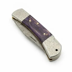 Close up of Damascus steel pattern on clip point blade