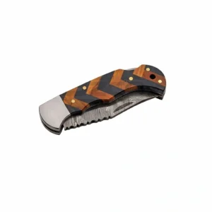 Closed wood pocket knife showing zigzag handle pattern and lanyard hole