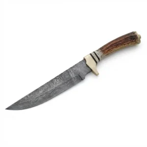 Profile view of stag handle damascus hunting knife showing brass guard and spine filework.