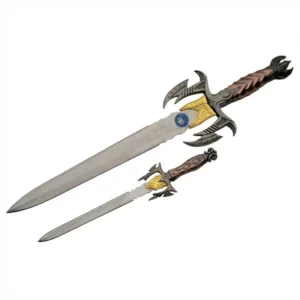 Close up of ornate cast metal handle with gold and pewter finish.