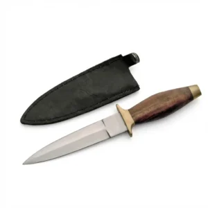 Stainless steel boot dagger with a polished wooden handle and brass guard, shown next to its black leather sheath.