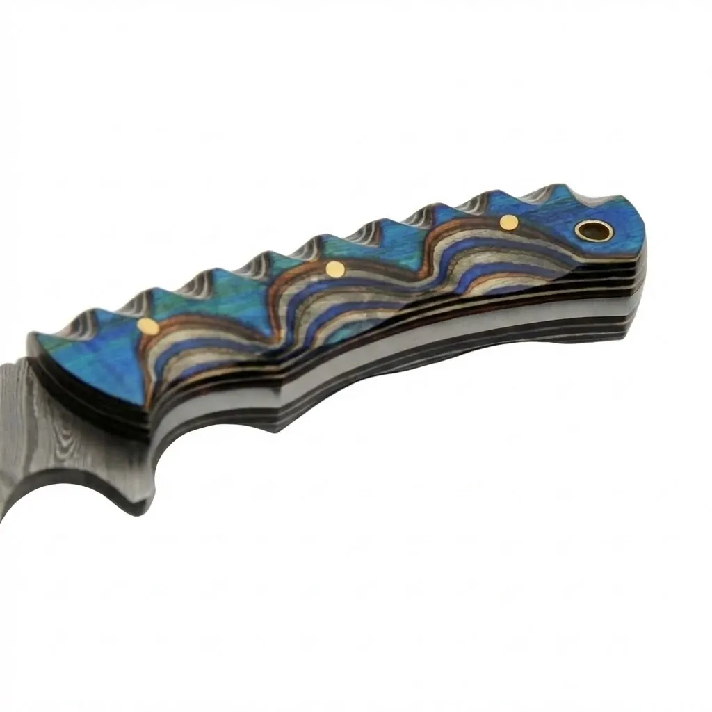 blue-river-hunter-knife-spine-filework Top view of Blue River Hunter knife spine showing decorative metal filework and layered blue handle scales.