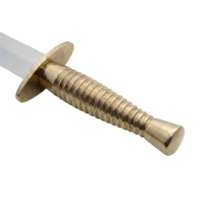 Closeup of the ribbed solid brass handle and oval guard on the Commando Dagger, highlighting the machined grip texture.