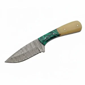 Close up of hand-forged Damascus steel pattern on a skinner blade.