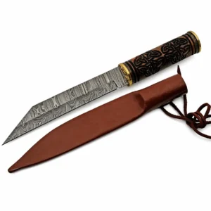 Full view of a 13.75-inch Damascus steel Celtic seax knife lying next to its brown leather sheath on a white background.