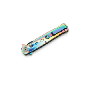 Close-up of the rainbow titanium folding knife in a closed position showing the stainless steel pocket clip.