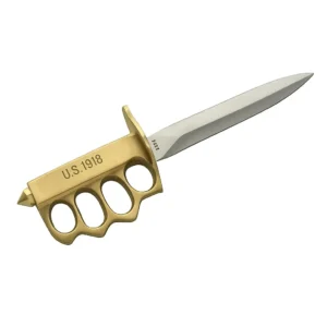 Close up of stainless steel dagger blade and brass knuckle grip.